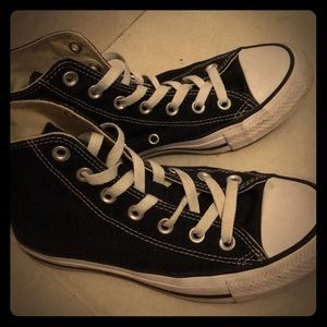 Black and white high-top converse.